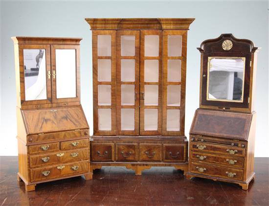 A Fergus Lane miniature 18th century style walnut bookcase,